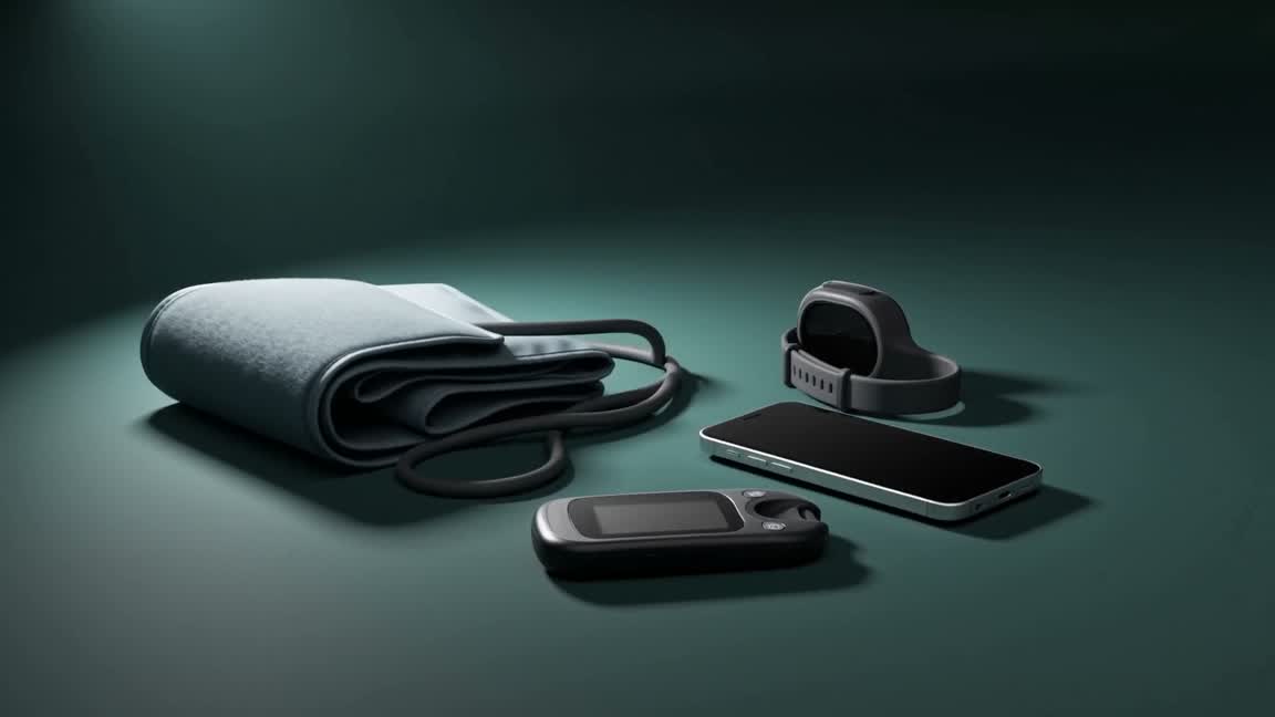 A blood glucose meter, a blood pressure cuff, a fitness band and a phone resting together.